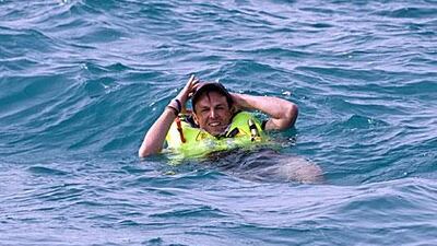 Graeme Swann, the England cricketer, looks relaxed after he took a dip off the deck of Azzam, the Abu Dhabi Ocean Racing yacht, on Saturday.