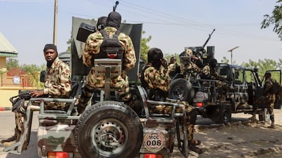 Soldiers prepare to patrol during a visit by Nigeria's Chief of Defence Staff Gen Olufemi Oluyede at the joint task force headquarters in Maiduguri. AFP