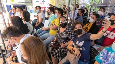 People from the Philippines prepare to cast their votes in Al Qusais, Dubai