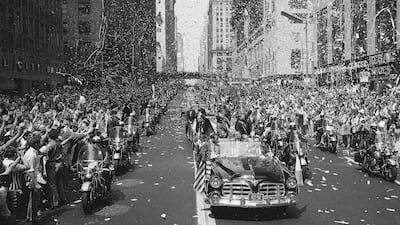 People line 42nd Street in New York to cheer Apollo 11 astronauts traveling towards the United Nations. AP Photo