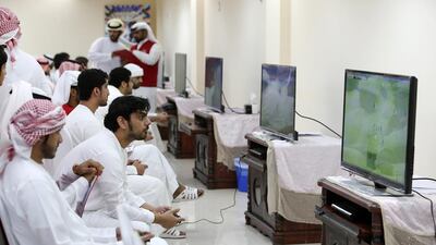 Players take part in last year’s video football competition. This year they will be playing for prize money of up to Dh1m. Pawan Singh / The National