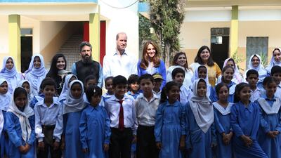 The couple made time to meet children while visiting the Islamabad Model College for Girls in Islamabad, Pakistan. EPA