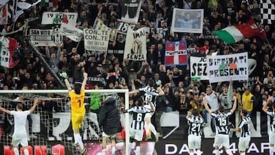Juventus players celebrate at the end of their Serie A match against AC Milan at Juventus Stadium. Giorgio Perottino / Reuters