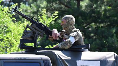 A Russian serviceman patrols near the Ukrainian town of Shchastia on June 11. AFP