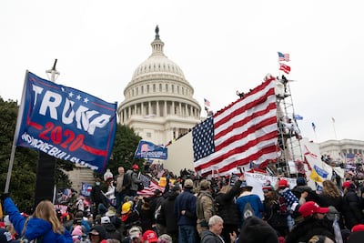Violent insurrectionists loyal to then US president Donald Trump stand outside the Capitol in Washington on January 6. AP Photo