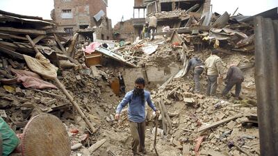 People work near collapsed houses after last week's earthquake in Bhaktapur, Nepal. Navesh Chitrakar / Reuters