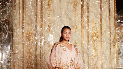 The finale was clouds of tulle, caught to create a hanging garden with gold tendrils