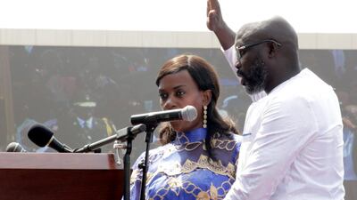 Liberia's George Weah raises his hand during his presidential swearing-in ceremony at the Samuel Kanyon Doe Sports Complex in Monrovia on January 22, 2018. Thierry Gouegnon / Reuters