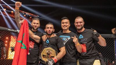 Xavier Alaoui celebrates the title win with his team.