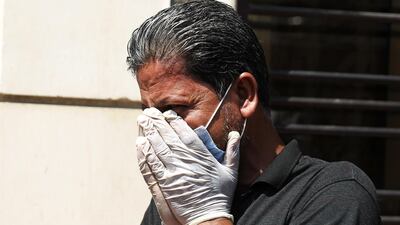 A mourner cries during the funeral. Al Hashimi had warm ties with top decision-makers, including President Barham Saleh, but was also trusted by rival parties and armed groups, which used him as a mediator. AFP