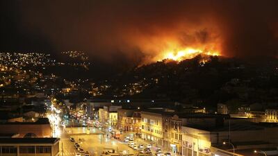 The fire was fueled by strong Pacific coast winds, (Cesar Pincheira / Reuters / April 12, 2014