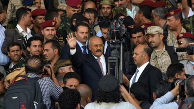 Yemen's former president Ali Abdullah Saleh (C) waves during the 35th anniversary celebration of his General People's Congress party in Sanaa, Yemen, on August 24, 2017. Hani Al Ansi / The Associated Press