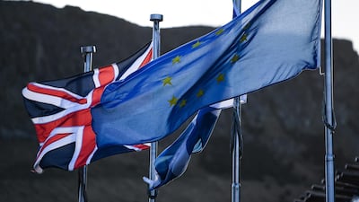 A Union Jack, Saltire and United Nations flags fly outside the Scottish Parliament in Edinburgh, Scotland. Getty Images