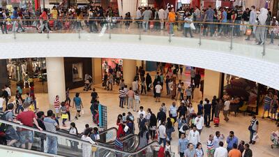 People shop during the flash sale held at Yas Mall on the first day of Eid Al Fitr in Abu Dhabi. Pawan Singh / The National