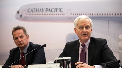 Cathay chairman John Slosar, (R), and CEO Rupert Hogg. Airline has reversed two straight years of losses. EPA