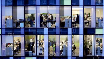 Workers in the offices of the Palestra Tower in London. Employment numbers in the United Kingdom is at a record high. Oli Scarff / Getty Images
