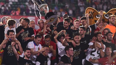 Valencia players pose with the Copa del Rey trophy. Getty