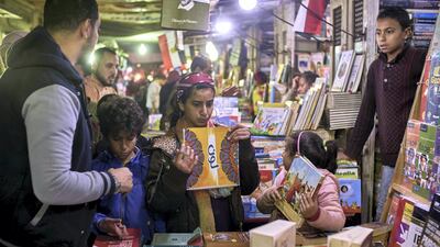 Customers search for books in the secondhand market in Soor El Azbakeya. Courtesy Hamada Elrasam