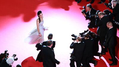 French actress Marion Cotillard poses as she arrives for the screening of the film L’Homme qu’on Aimait Trop (In the Name of my Daughter) at the Cannes Film Festival on May 21, 2014. Loic Venance / AFP