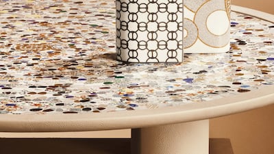 Tiny pieces of porcelain cover a tabletop. Photo: Nacho Alegre