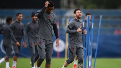 Lionel Messi, right, during training. AFP