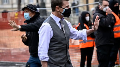Tom Cruise greets fans during the shooting of 'Mission: Impossible 7' at Piazza Venezia in Rome, Italy on November 29, 2020. EPA
