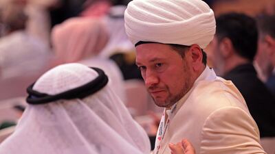 Representatives of various faiths attend the interfaith conference. AFP