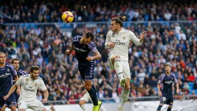 Real Madrid's Gareth Bale heads the ball towards the goal. AP Photo