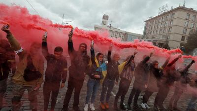 Ukrainians burn smoke grenades during their rally against the signing of the 'Steinmeier formula' by Ukrainian delegation in Minsk, on the Independence Square in Kiev, Ukraine, October 6, 2019. Thousands Ukrainians gathered in downtown Kiev to protest after Ukraine responded to 'Steinmeier formula' peace settlement in Donbas as pending approval, during the Trilateral Contact Group (TCG) meeting in Minsk on September 30, 2019. EPA/SERGEY DOLZHENKO