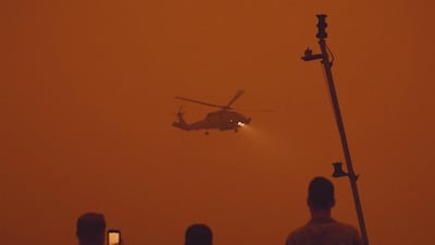 HMAS Adelaide docked off the coast at Eden, NSW, Australia. Australian Department of Defence / EPA
