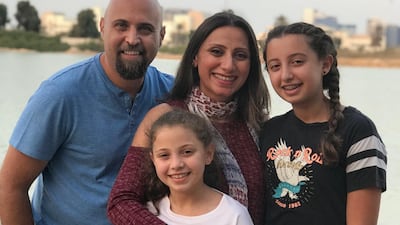 Maei Jeneidi with her husband and daughters. Masa, 12, who wants to fast for the entire month and Sama, 9, who will fast for as many days as she can. Courtesy Maei Jeneidi