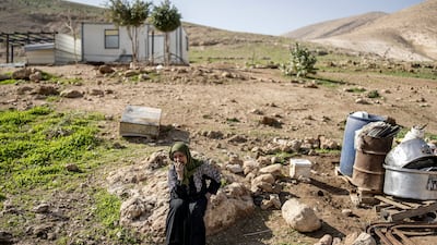 A woman weeps as she prepares to leave her family home, after harassment by Israeli settlers in the occupied West Bank. AFP