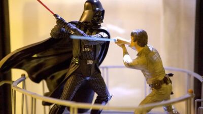 Miniature figurines of Darth Vader and Luke Skywalker are part of Al Bahiti's collection.
