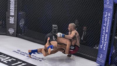 Emirati Yousef Al Husani takes down Egyptian Mohamed Allam enroute to his debut win in the featherweight 66kg. Courtesy UAE Warriors