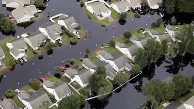 This aerial photo shows flooding around homes in the Carolina Forest community in Horry County, South Carolina. Janet Blackmon Morgan / The Sun News via AP