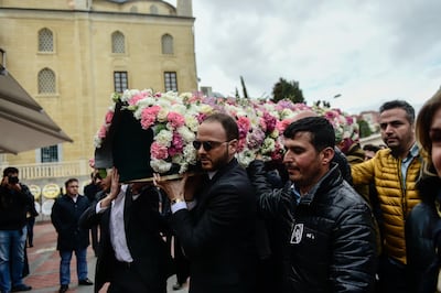 Relatives carry the coffin of Mina Basaran. AFP