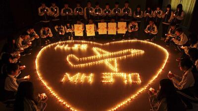 International school students light candles to pray for passengers aboard Malaysia Airlines flight MH370, in Zhuji, Zhejiang province, China. Reuters March 10
