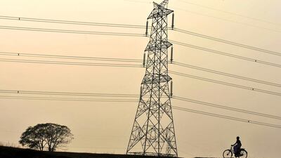 An Indian schoolgirl cycles home from school at Fulbari village, on the outskirts of Siliguri. Diptendu Dutta / AFP