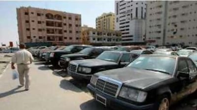 Luxurious older vehicles at the numerous used car dealerships in Sharjah's Abu Shagara district.