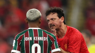 Fluminense's John Kennedy with coach Fernando Diniz. Reuters