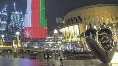 Dubai, United Arab Emirates- Burj Khalifa with the Omani flag for the Omani national day. Leslie Pableo for The National