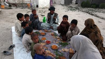An internally displaced Afghan family breaks their fast during the holy month of Ramadan in Kabul, Afghanistan, on June 20, 2015. Devout Muslims throughout the world are marking the month of Ramadan, the holiest month in the Islamic calendar during which devotees fast from dawn till dusk. Rahmat Gul / AP photo