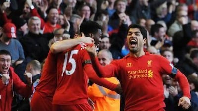 After plenty of controversy, Liverpool's Luis Suarez scored his league-leading 23rd goal of the season in the 97th minute to earn Liverpool a 2-2 draw with Chelsea. Peter Powell / EPA