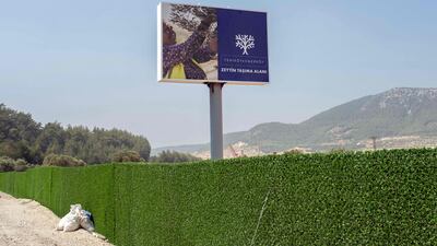 A billboard that states, 'Olive carrying area' erected by the coal-fired Yenikoy power station in Milas, in the south-western Mugla province