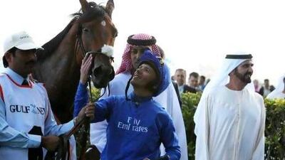 Sheikh Mohammed bin Rashid, right, has had many successes at Meydan Racecourse, including Gamilati, ridden by Frankie Dettori in February.