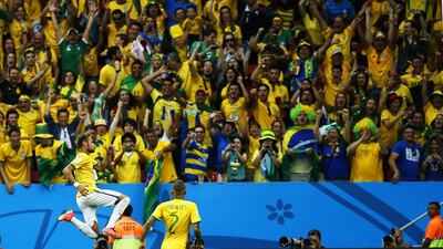 Neymar, left, proved to be the star player for Brazil and the face of World Cup 2014. Adrian Dennis / AFP
