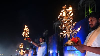 Hindu priests perform rituals as pilgrims look on at the confluence of the Ganges River and the Bay of Bengal during the Ganga Sagar Mela. AFP