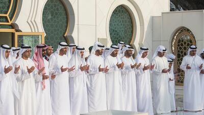 ABU DHABI, UNITED ARAB EMIRATES - June 25, 2017: HH Sheikh Mohamed bin Zayed Al Nahyan, Crown Prince of Abu Dhabi and Deputy Supreme Commander of the UAE Armed Forces (6th L), prays at the grave of his father the late HH Sheikh Zayed bin Sultan bin Zayed Al Nahyan, President of the United Arab Emirates, during Eid Al Fitr prayers at the Sheikh Zayed Grand Mosque. Seen are (L-R) HH Sheikh Khaled bin Zayed Al Nahyan, Chairman of the Board of Zayed Higher Organization for Humanitarian Care and Special Needs (ZHO), HH Sheikh Mansour bin Zayed Al Nahyan, UAE Deputy Prime Minister and Minister of Presidential Affairs, HH Sheikh Tahnoon bin Zayed Al Nahyan, UAE National Security Advisor, HH Sheikh Saeed bin Zayed Al Nahyan, Abu Dhabi Ruler's Representative, HH Sheikh Hazza bin Zayed Al Nahyan, Vice Chairman of the Abu Dhabi Executive Council, HH Sheikh Mohamed bin Zayed Al Nahyan, Crown Prince of Abu Dhabi and Deputy Supreme Commander of the UAE Armed Forces, HE Dr Mohamed Matar Salem bin Abid Al Kaabi, Chairman of the UAE General Authority of Islamic Affairs and Endowments, HH Sheikh Nahyan Bin Zayed Al Nahyan, Chairman of the Board of Trustees of Zayed bin Sultan Al Nahyan Charitable and Humanitarian Foundation, HH Lt General Sheikh Saif bin Zayed Al Nahyan, UAE Deputy Prime Minister and Minister of Interior, HH Sheikh Hamed bin Zayed Al Nahyan, Chairman of the Crown Prince Court of Abu Dhabi and Abu Dhabi Executive Council Member, and HH Sheikh Abdullah bin Zayed Al Nahyan, UAE Minister of Foreign Affairs and International Cooperation.
( Ryan Carter / Crown Prince Court - Abu Dhabi )
---