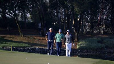 Rickie Fowler, Rory McIlroy and Jordan Spieth walk to the green during the first round of the Abu Dhabi HSBC Golf Championship on Thursday. Karim Sahib / AFP / January 21, 2016
