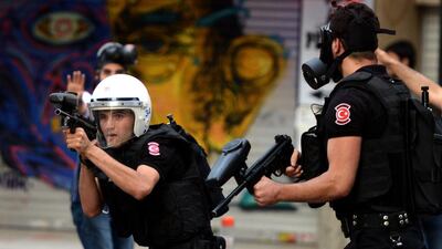 Turkish riot police fire rubber bullets to disperse protesters during a demostration in Istanbul on July 24. Turkey detained hundreds of people in coordinated nationwide dawn raids against suspected militants and Kurdish militants following a wave of deadly violence in the country, the prime minister's office said. AFP Photo
